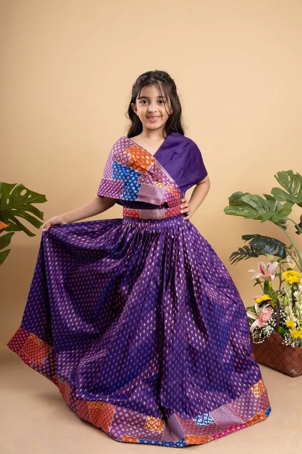 Elegant purple silk lehenga choli with vibrant patchwork detailing, perfect for festive celebrations