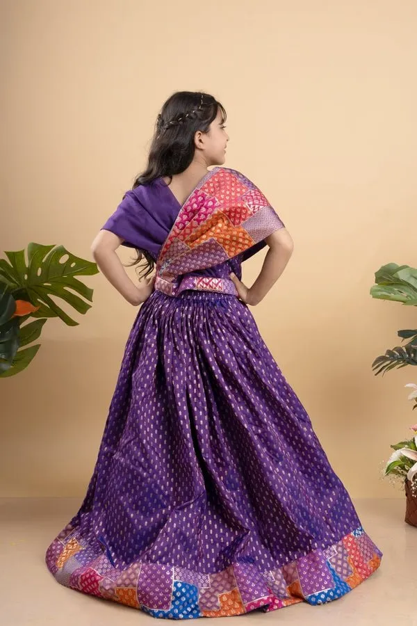 Elegant purple silk lehenga choli with vibrant patchwork detailing, perfect for festive celebrations